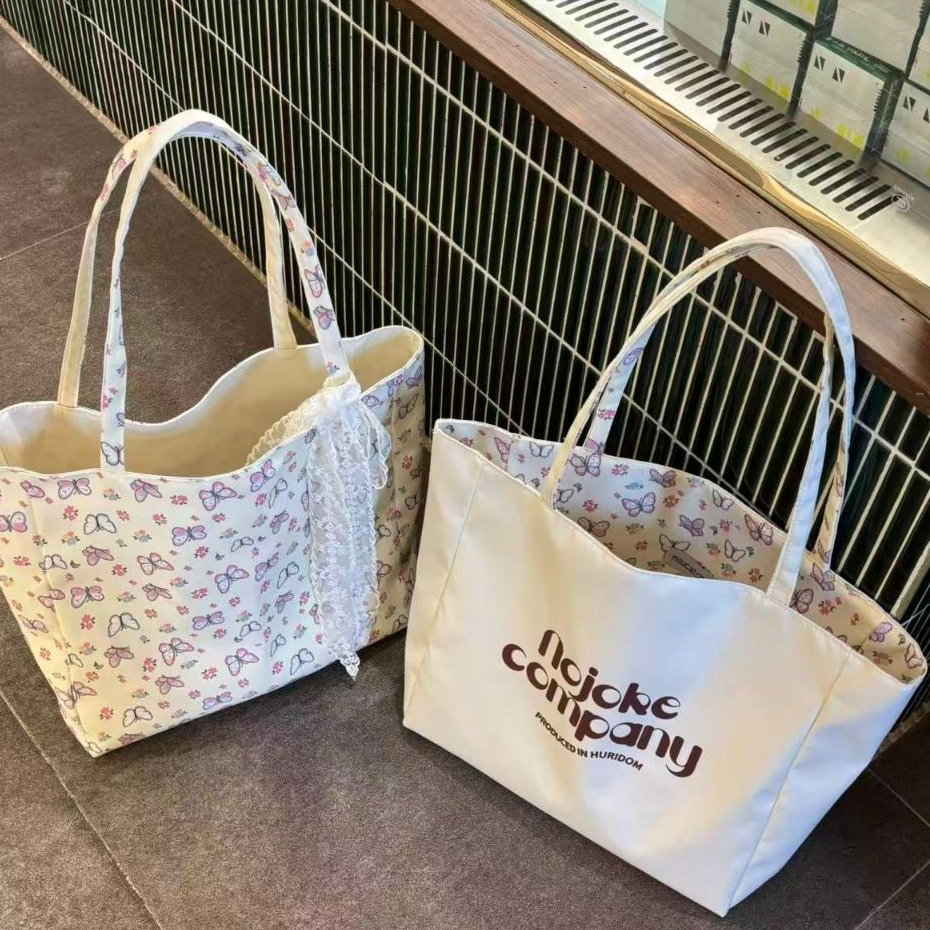 กระเป๋าสะพายเกาหลีสไตล์ลําลอง ใหม่ ลายผีเสื้อ แบบสองด้านจากผ้าใบ สําหรับผู้หญิงและนักเรียน ความจุขนาดใหญ่ สำหรับการเดินทางทุกวัน