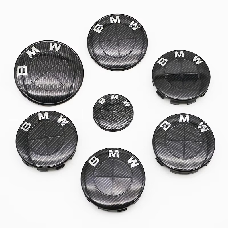 7 ชิ้นไฟเบอร์สีดํารถศูนย์ล้อหมวก Hub ฝาครอบ Badge Auto Hood ด้านหน้าด้านหลังสัญลักษณ์สําหรับ BMW E85