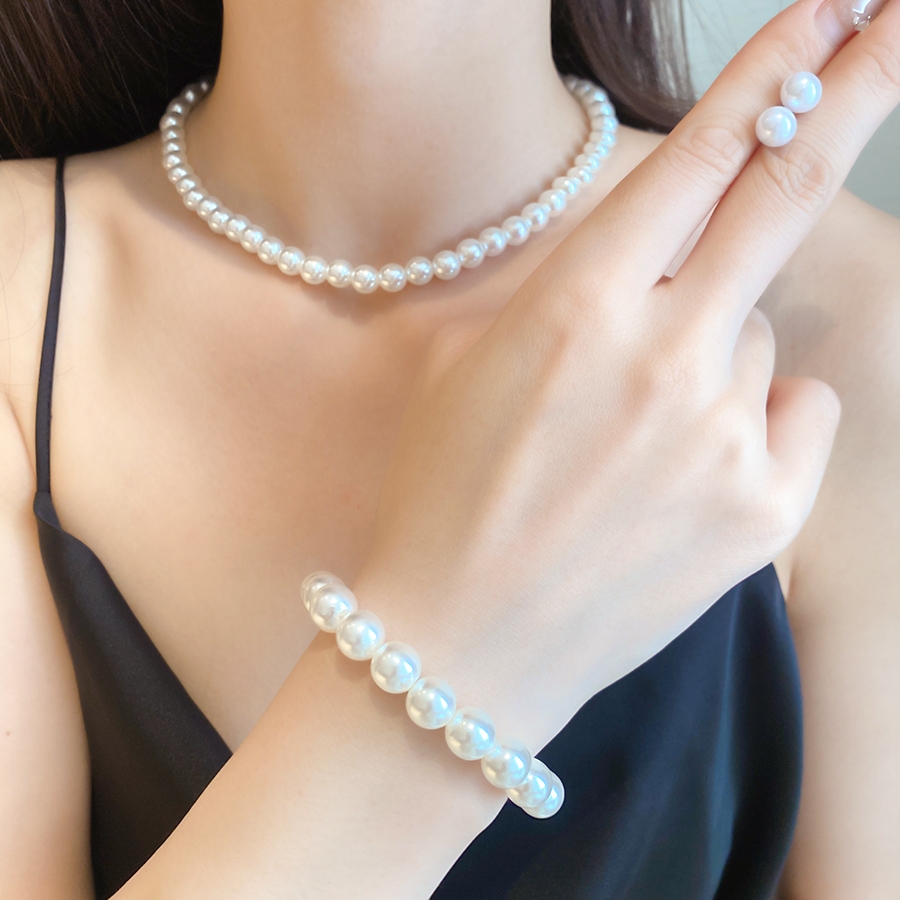 ชุดเครื่องประดับมุกเทียมสร้อยคอสร้อยข้อมือและต่างหูสตั๊ดอุปกรณ์เสริมที่หรูหราและอเนกประสงค์สําหรับผู้หญิงสวมใส่ทุกวัน