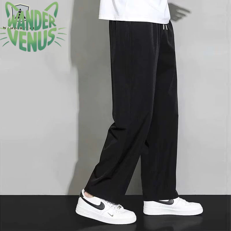 Wandervenus กางเกงผู้ชายสีทึบเรียบง่ายอินเทรนด์กางเกงฮาเร็มลําลองทรงหลวม