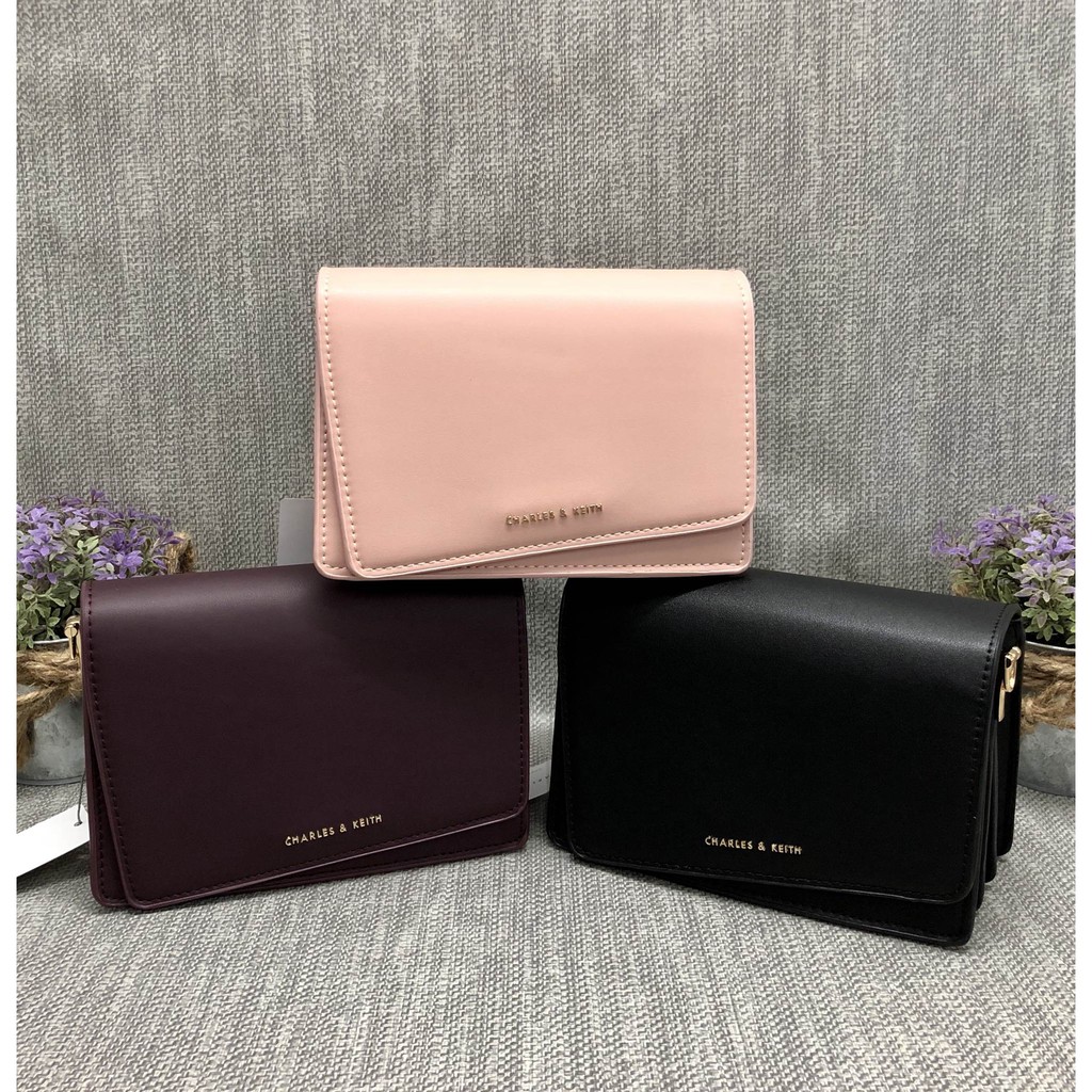 charles and keith asymmetric front flap bag