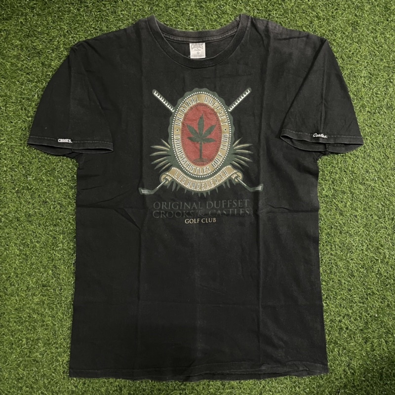 PRONTO CROOKS CASTLE เสื้อยืดผู้ชาย สวยๆ เสื้อผ้าผู้ชาย คอกลม แขนสั้น สีดำ ลาย Original Duffset ผ้าค