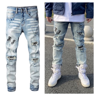 AMIRI new ripped denim knife cut and leather slim jeans