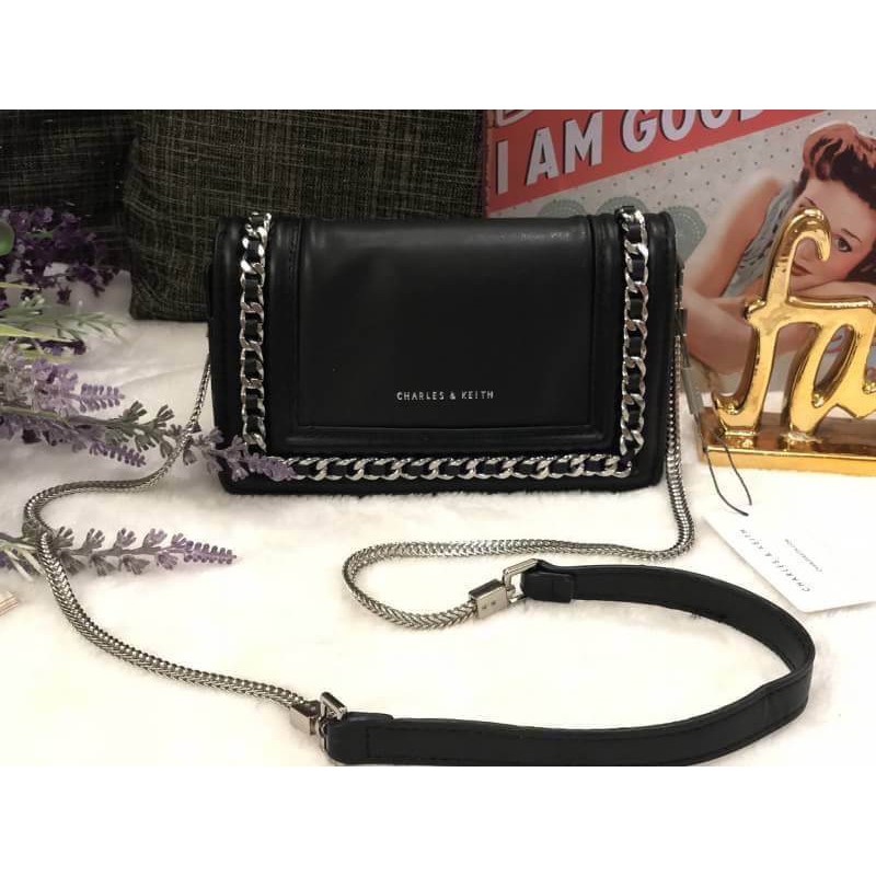 charles and keith chain detail clutch