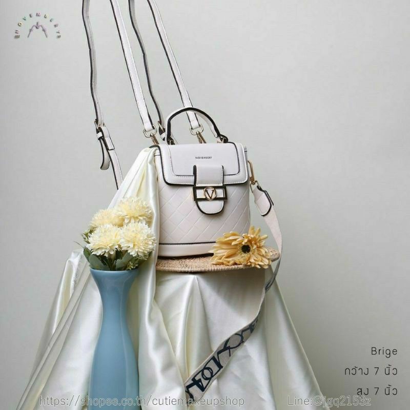 กระเป๋าสะพาย แบรนด์แท้ Novembery mini backpack ทำเป็นเป้ได้ มาพร้อมสายสปอร์ต สีเบจ