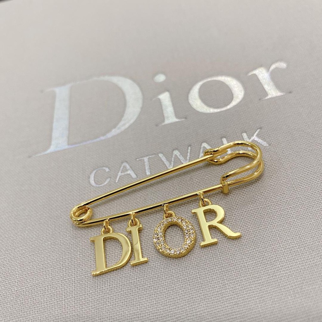 dior safety pin brooch