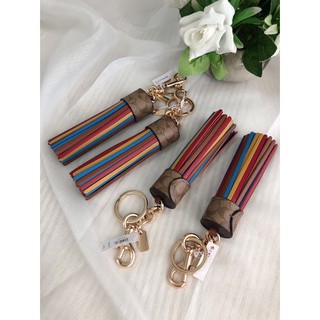 (ส่งฟรี) COACH TASSEL BAG CHARM IN COLORBLOCK SIGNATURE CANVAS พวงกุญแจ