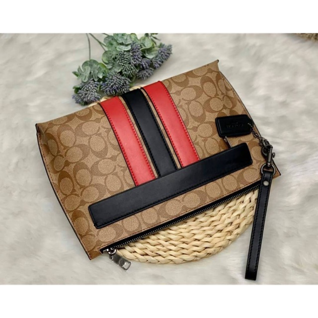 COACH CARRYALL POUCH IN SIGNATURE WITH VARSITY STRIPE