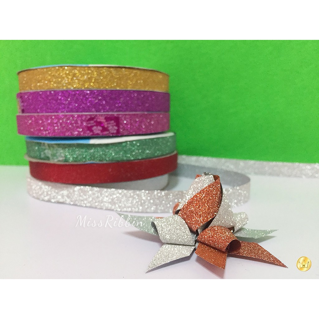 ริบบิ้นพับเหรียญ ริบบิ้นกากเพชร ตราระฆัง เลือกสีได้ ยาว 25หลา