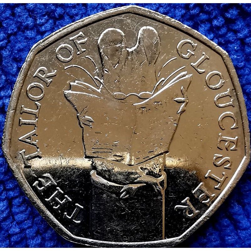เหรียญ​อังกฤษ​ UK, 50​ Pence, (วาระ​ที่ระลึก​ Tailor of​ Gloucester), #1346T, ไม่​ผ่าน​ใช้​ UNC