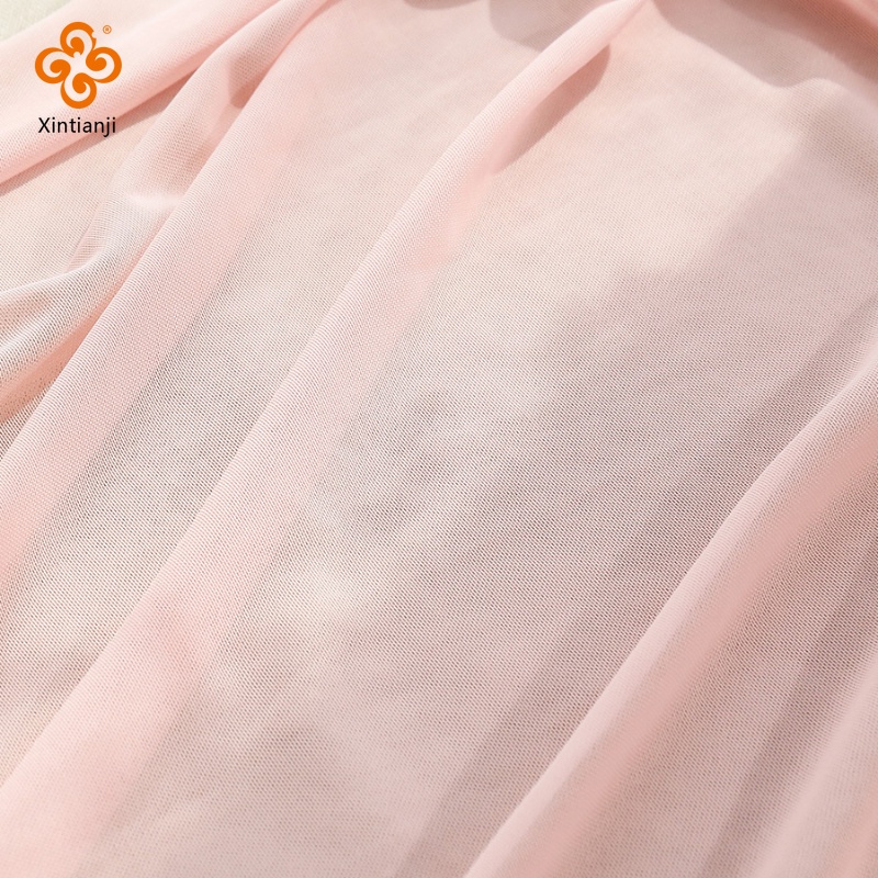 45x150 ซม.4-way ยืด Soft Nude สีชมพูตาข่าย Tulle ผ้าโดยครึ่งหลาสําหรับเย็บเสื้อผ้า Backing ชุดงานแต่งงานเสื้อผ้า TJ7125