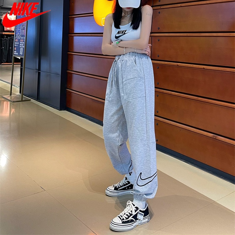 Nike ของแท้ 100% กางเกงวอร์มลําลอง ทรงหลวม ทรงตรง เหมาะกับการวิ่งจ๊อกกิ้ง เล่นกีฬา สําหรับผู้หญิง