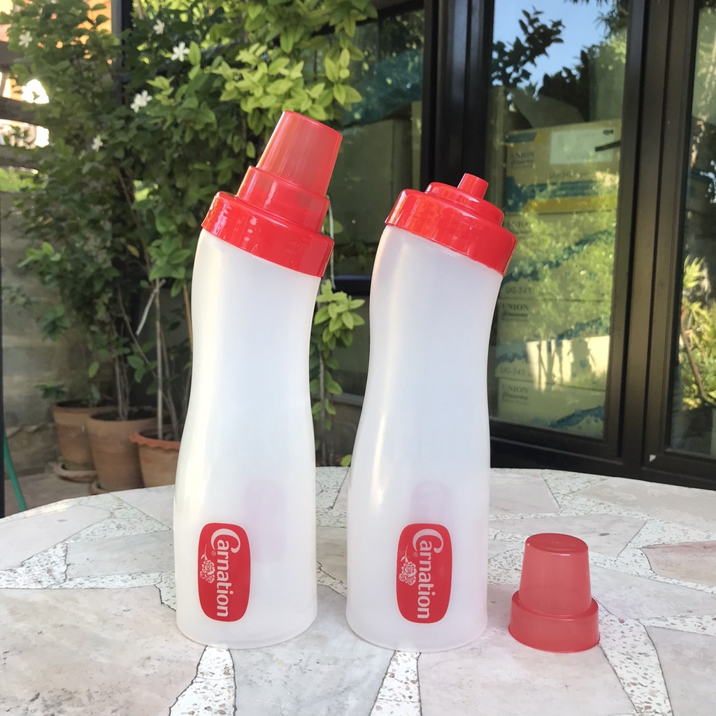 ขวดบีบซอสคาร์เนชั่น ฝาปิดจุก ความจุ 750ml สูงรวมฝาจุก 26cm ราคาใบละ