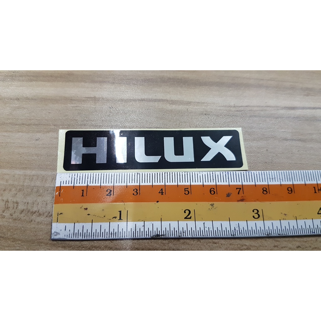 สติกเกอร์ ไฮลัก วีโก้ โตโยต้า ติดด้านหลัง ขนาด 7 * 1.5 cm *HILUX* toyota vigo champ sticker logo