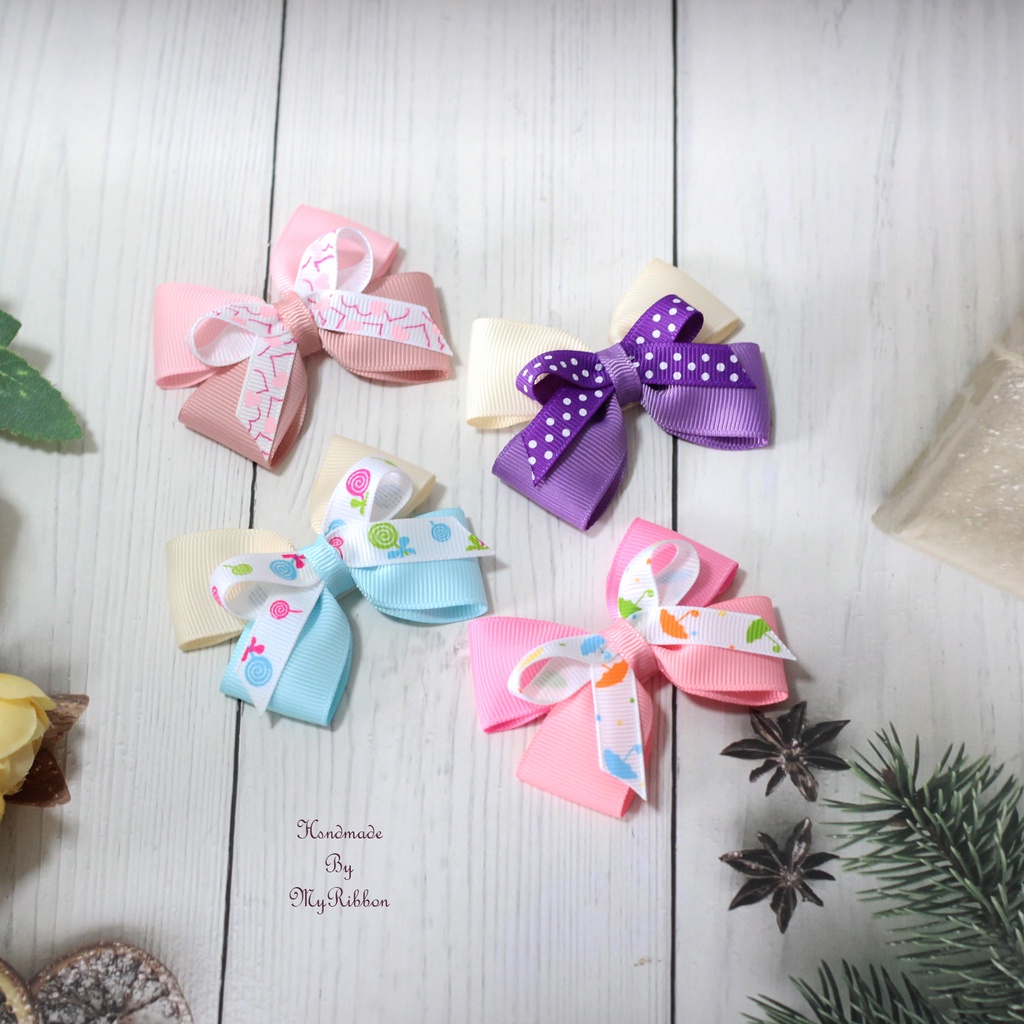 กิ๊บติดผมเด็ก/โบติดผมแฮนด์เมด สีพื้นติดโบลวดลายน่ารัก ราคาคู่ละ 35 บาท