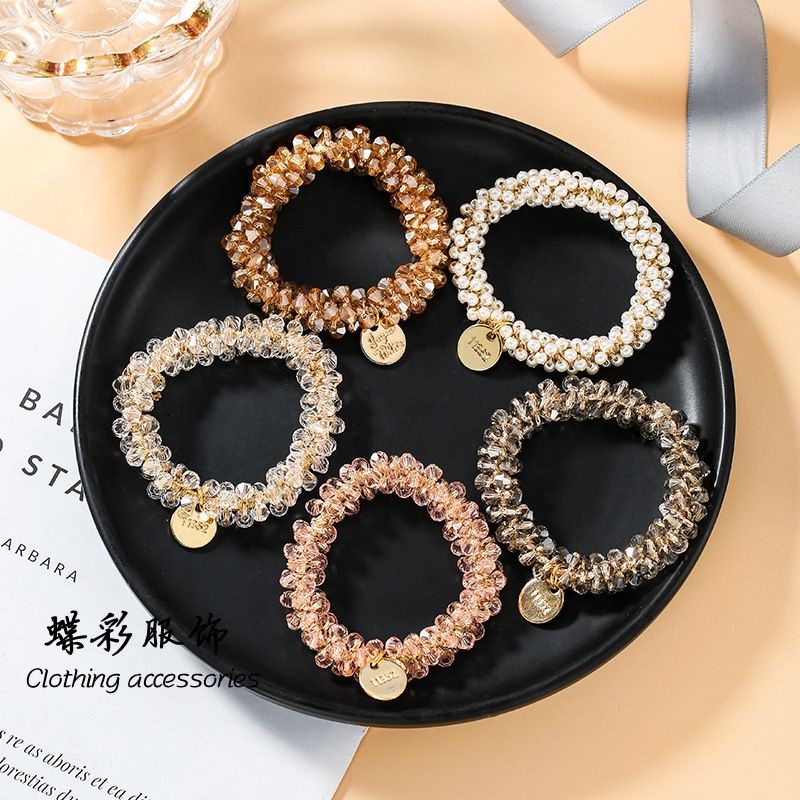 ยางรัดผมคริสตัล​ และไข่มุก​ สวย​ รัดแน่นค่ะ