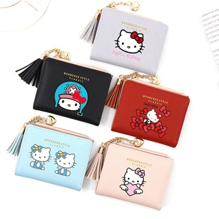 กระเป๋าสตางค์ ใบสั้น ลายการ์ตูน Hello Kitty แต่งพู่ แบบพับได้ ใส่เหรียญ บัตรได้ แฟชั่นสําหรับสตรี