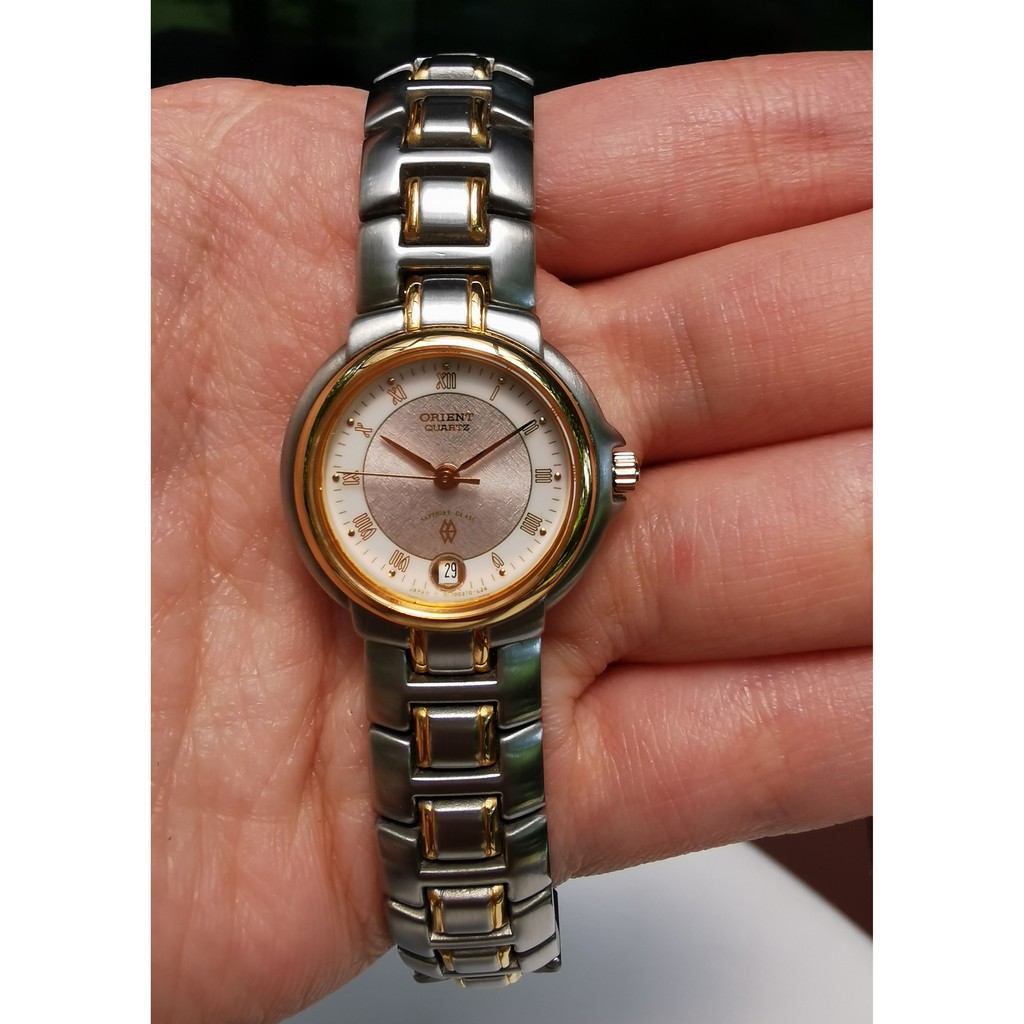 Orient นาฬิกาผู้หญิง สองกษัตริย์ หน้าครีมทอง ระบบQuartz