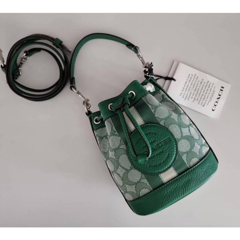 (ผ่อน0%) กระเป๋าสะพายข้าง ทรงบัคเก็ต Coach C8322 Mini Dempsey Bucket Bag In Signature Jacquard In Green ลายซีสีเขียว