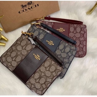 COACH SMALL WRISTLET IN SIGNATURE JACQUARD