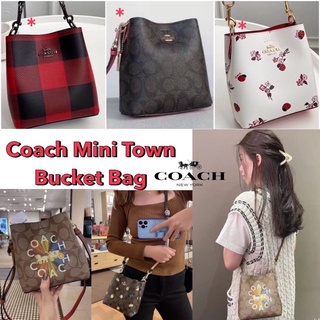 MINI TOWN BUCKET BAG IN SIGNATURE CANVAS