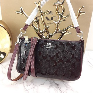 COACH TOP HANDLE POUCH IN SIGNATURE DEBOSSED PATENT LEATHER