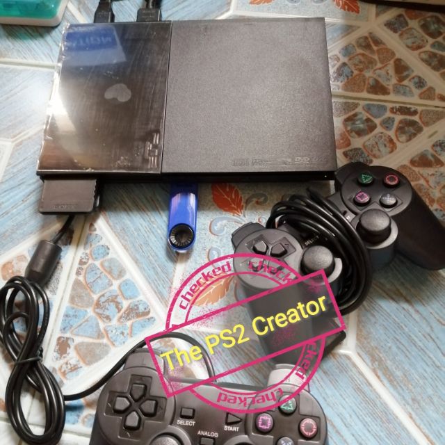 PS2​ รุ่น​ 90006​ แปลงเครื่อง​ MODBO​ 5.0​ เล่นเกมด้วยแฟลชไดร์ฟ​ 16​ GB, 32​ GB, 64​ GB​ (เลือกเกมได