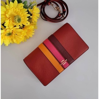 (ผ่อน0%) กระเป๋าสะพายข้าง ANNA FOLDOVER CROSSBODY CLUTCH WITH VARSITY STRIPE (COACH 2632) หนังแท้ สีน้ำตาลอิฐ