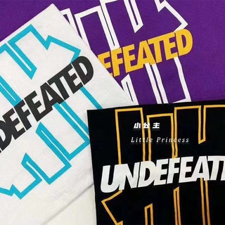 สินค้าใหม่ UNDEFEATED เสื้อยืดแขนสั้น สีพื้น สําหรับผู้ชาย และผู้หญิง