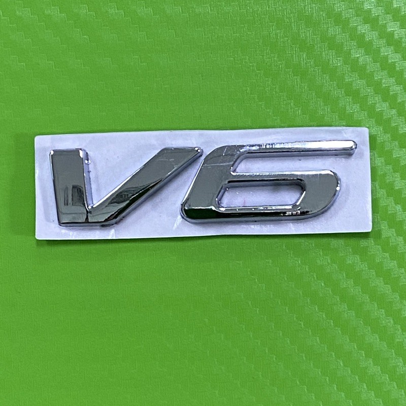 โลโก้* V6 สีเงิน งานโลหะ ขนาด* 1.8 x 6.8 cm ราคาต่อชิ้น