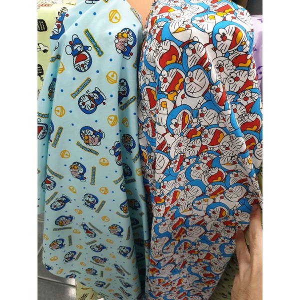 ผ้าลายการ์ตูน​ โดเรม่อน ผ้าคอตตอลผสม ทีซีการ์ตูน 013 ผ้าเมตร คอตตอน ถ่ายพร็อพ ฉาก ปูโต๊ะ หน้ากว้าง 110-115cm - รูปที่ 2