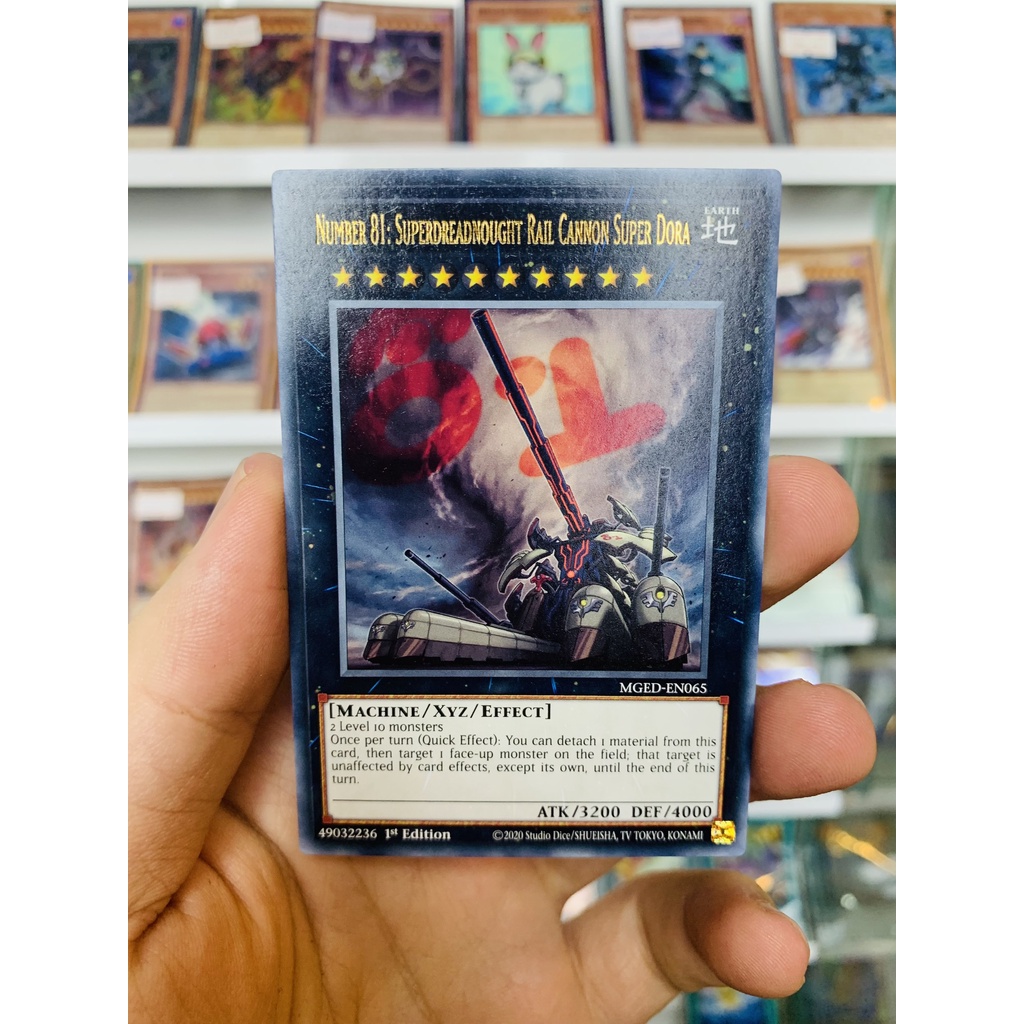YugiOh! Odd Card Code MGED-EN065 - Number 81: Superdreadnyching Rail Cannon Super Dora - Gold-Letter