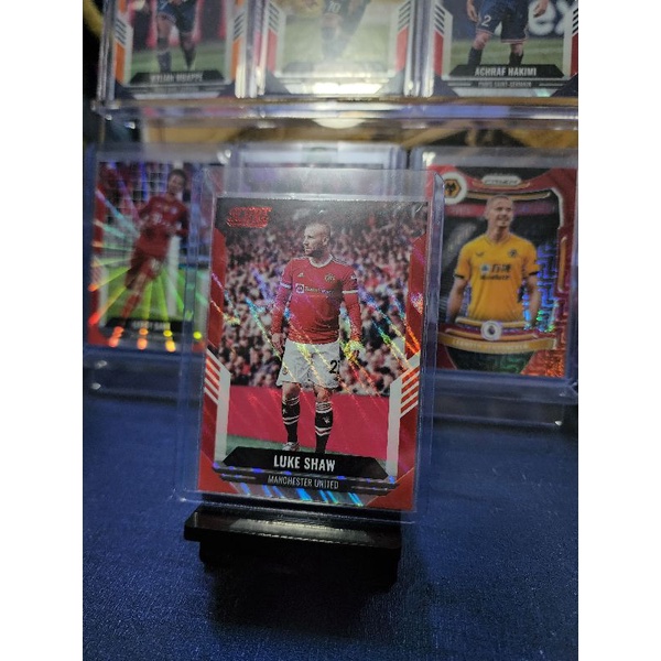 การ์ดบอลFIFA-SCORE-MANU-LUKE SHAW-RED LAVA🔴