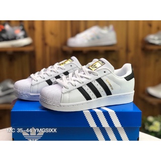 ◘✑ของแท้ จัดส่งฟรี  Adidas Originals Superstar รองเท้าลำลอง รองเท้ากีฬา (ขาว/สีดำ)