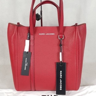 The Marc Jacobs The Tag 27 Leather Tote Bag pebbled leather tote bag. Layered top handles with hanging logo tag.