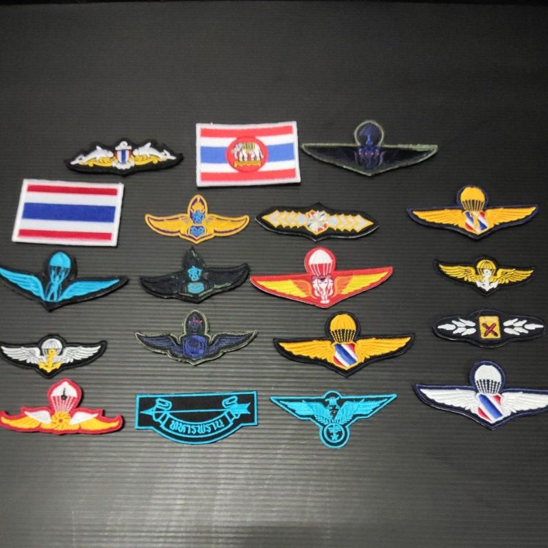 เครื่องหมายผ้าแบบเย็บและแบบตีนตุ๊กแก