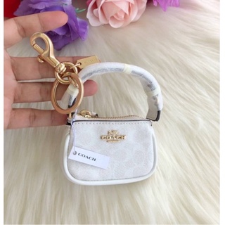 พวงกุญแจ รูปกระเป๋าพอช ลายซี สีขาว MINI NOLITA BAG CHARM IN SIGNATURE CANVAS (COACH C4310)