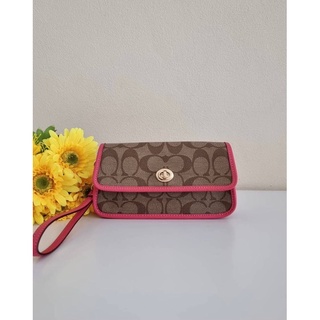 กระเป๋าคล้องมือ COACH ORIGINALS WRISTLET IN SIGNATURE CANVAS (COACH C2299) IM/KHAKI/FUCHSIA ลายซีสีน้ำตาล สายสีชมพู