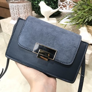 กระเป๋าสะพาย CHARLES STONE BUCKLE SLING BAG