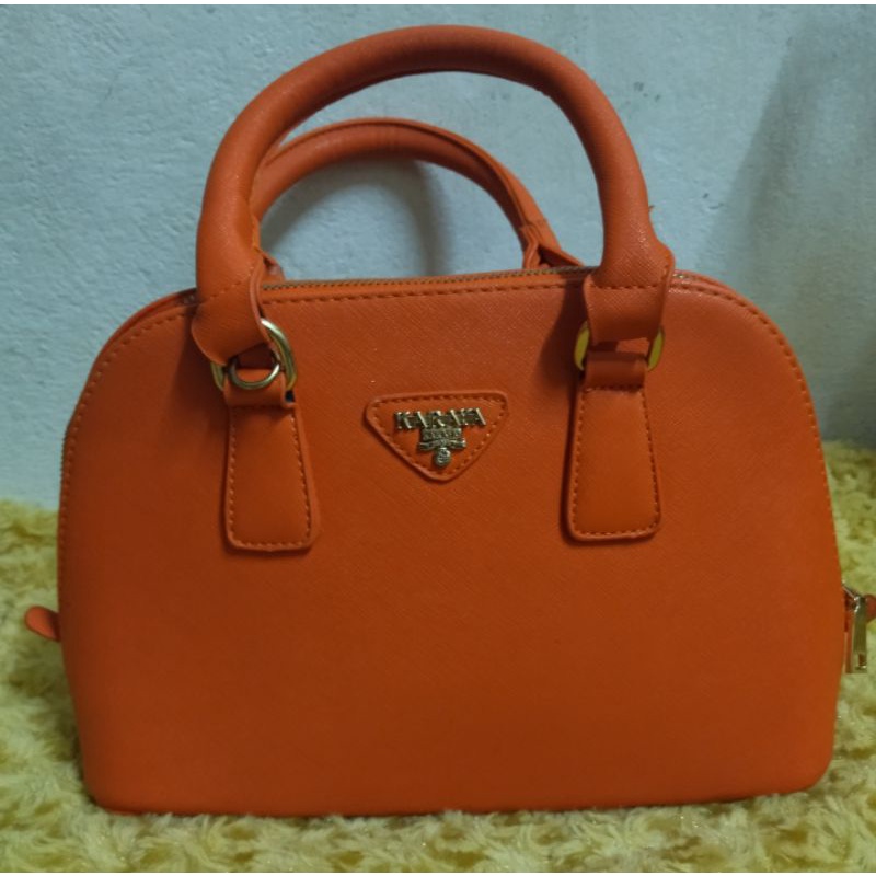 กระเป๋าถือ แฟชั่นKARAYA สีส้มขนาด12.5*7.5 งานน่ารัก แถมจัดส่งฟรีค่ะ