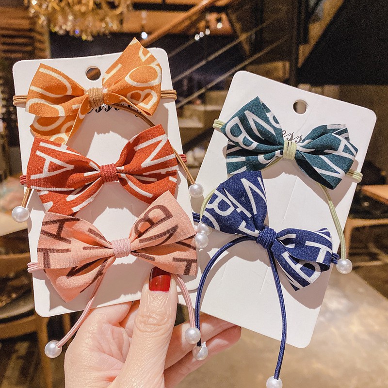 Fashion ยางรัดผม สุดหรู เส้นคู่ ห้อยไข่มุก มีหลายลาย น่ารัก พร้อมส่งจากไทย Q-106