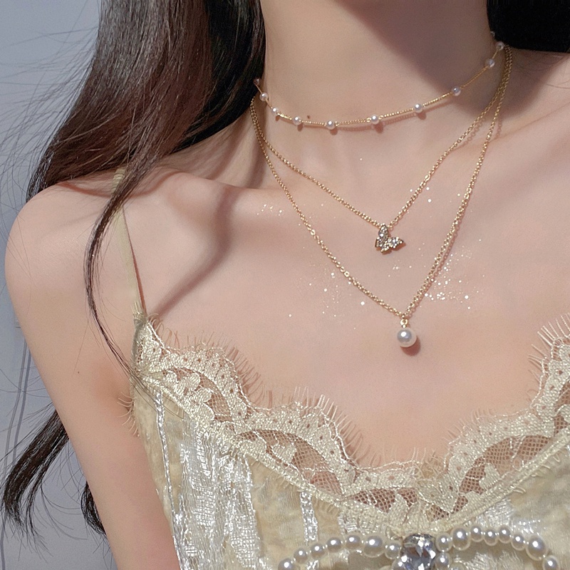 เครื่องประดับ สร้อยคอโชคเกอร์ จี้รูปผีเสื้อ ประดับไข่มุก และคริสตัล หรูหรา แฟชั่นสําหรับผู้หญิง