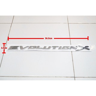 ป้ายโลโก้ตัวนูน พลาสติกสีโครเมี่ยม EVOLUTION X สำหรับติดฝากระโปรง ขนาด 36.5X3.0 cm ติดตั้งด้วยเทปกาวสองหน้าด้านหลัง