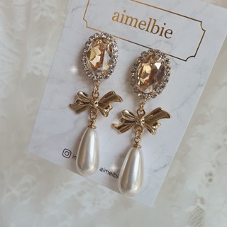 ♥ เครื่องประดับ รูปแอมเมลบี้ สไตล์เกาหลี ♥ ต่างหูริบบิ้น สีทองเงา (Kep1er Xiaoting Earrings)