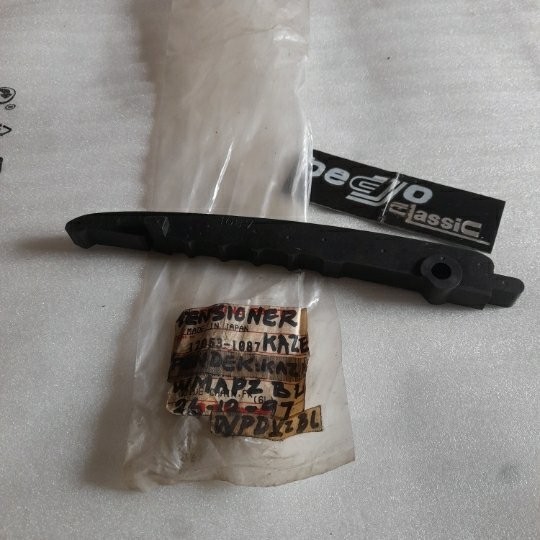 ยางลิ้น Tensioner ยางโซ่เพลาลูกเบี้ยวล่าง KAWASAKI KAZE E KAZE R เดิมแท้ KAWASAKI MADE IN JAPAN 1205