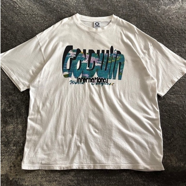 เสื้อยืดกราฟิกนานาชาติ Goldwin