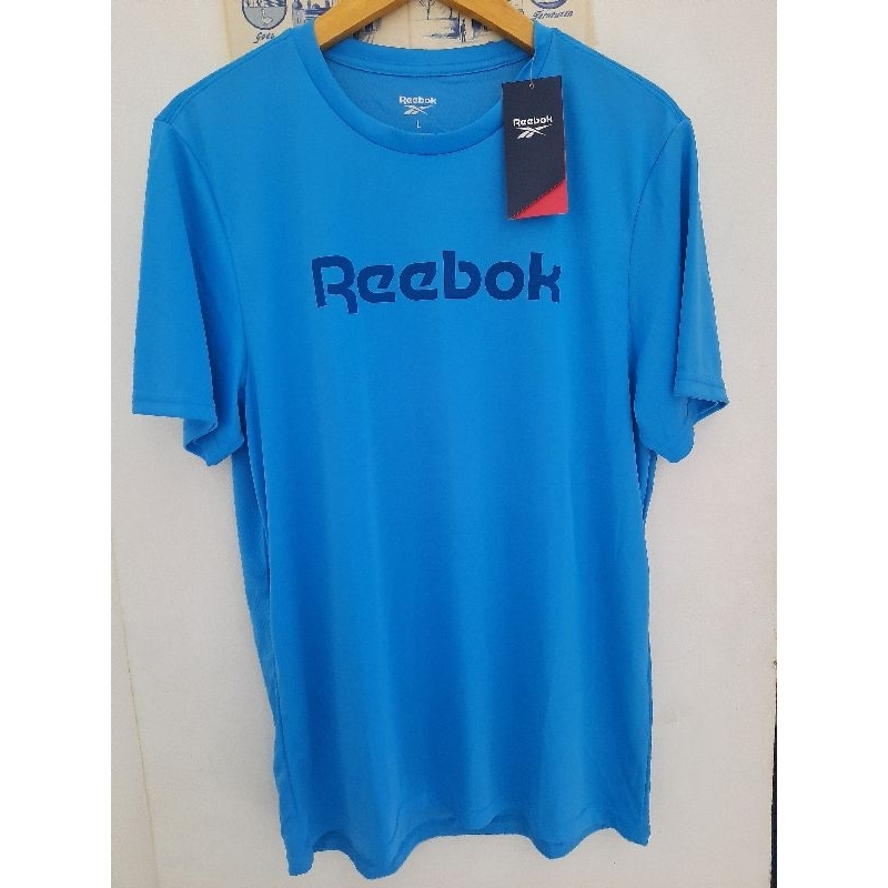 เสื้อยืดสีน้ําเงินผู้ชาย Reebok เสื้อกีฬาสีน้ําเงินสําหรับผู้ชาย Reebok