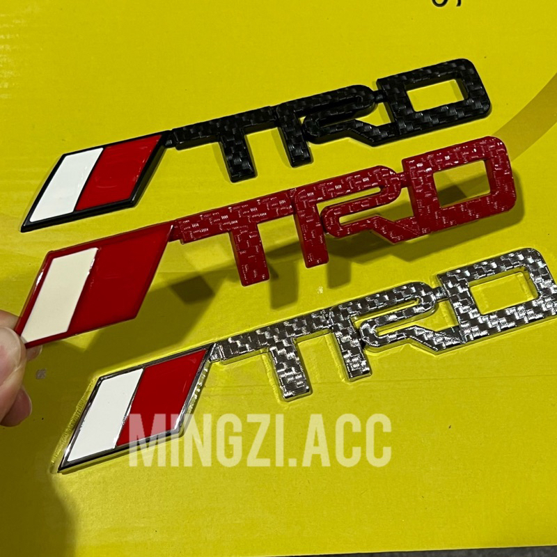 โลโก้เขียนสัญลักษณ์ TRD รุ่นสั้น สากล กระจังหน้ารถยนต์ MEDAN AVANZA FORTUNER RUSH INNOVA