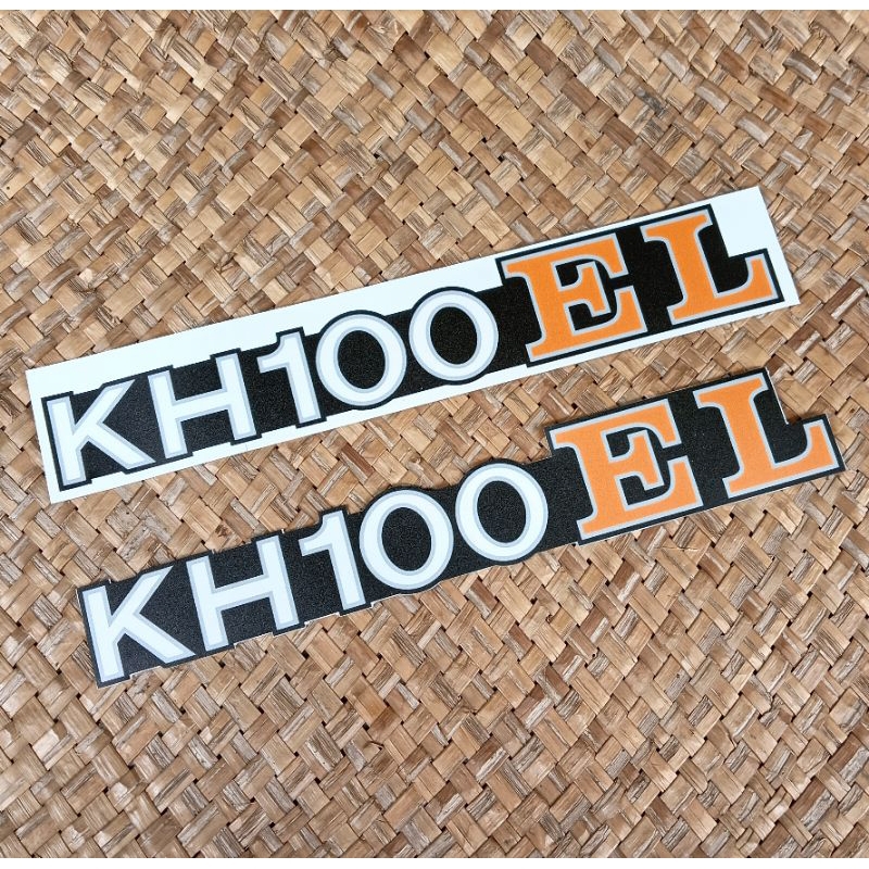 สติ๊กเกอร์สัญลักษณ์กล่องแบตเตอรี่ Kawasaki Binter KH100 EL สติ๊กเกอร์รีโปรตัด UV จากแสตมป์ ORIGINAL 2 ชิ้น