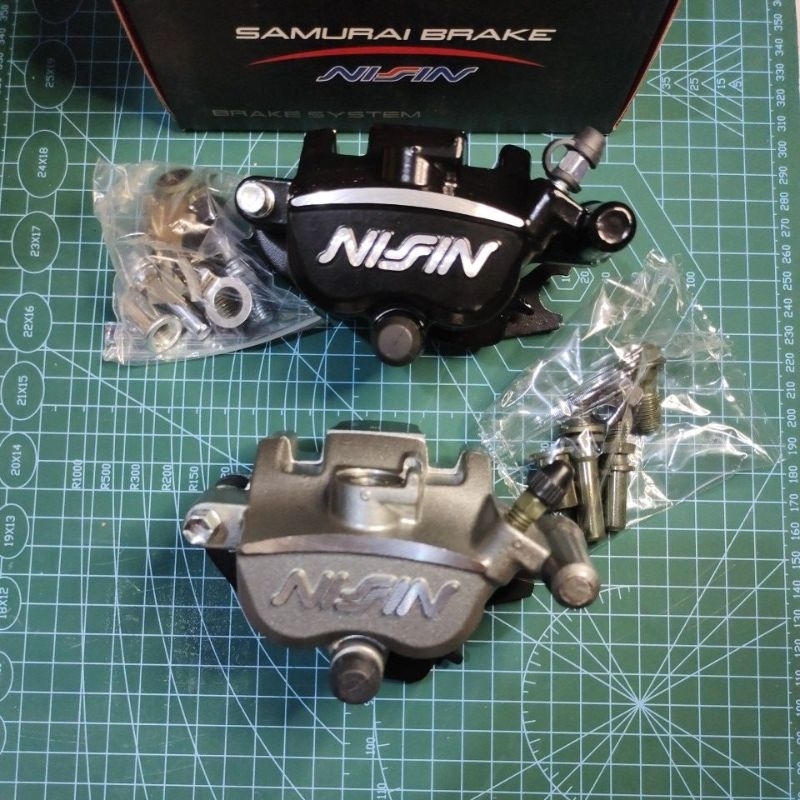 ลูกสูบ Nissin ขวา caliper 2p สากลสําหรับรถมอเตอร์ไซด์ทุกรุ่น